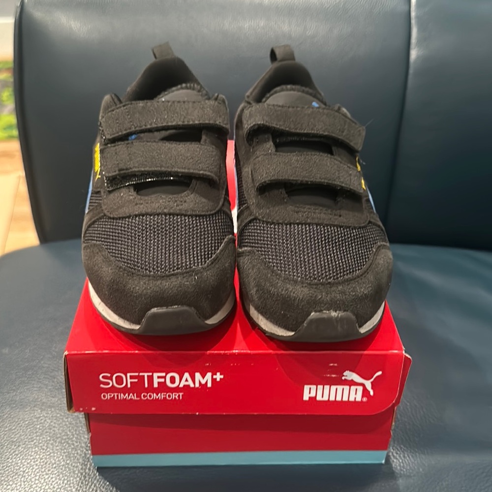 Puma Kids Black Sneakers with Blue and Yellow Accents